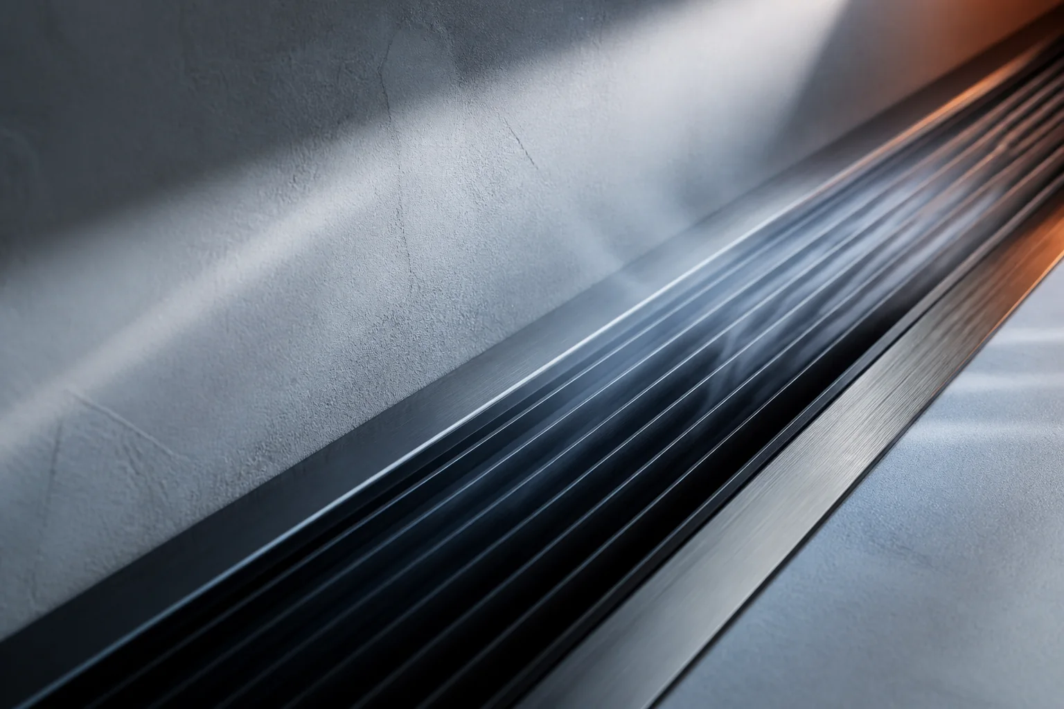 Close architectural detail of cool airflow moving across a dark metal vent